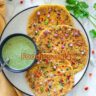 Golden brown besan chilla served with green mint chutney
